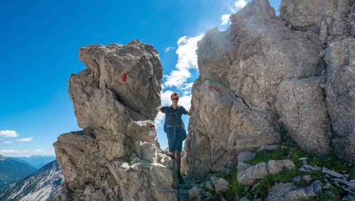Hiker stands between rocks