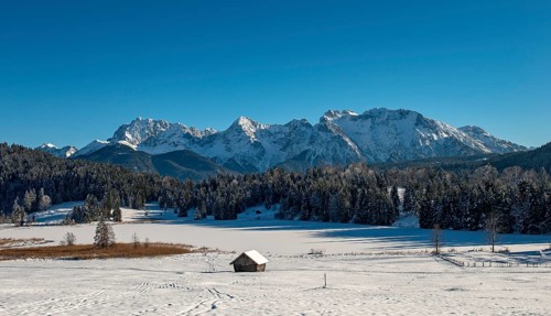 Frozen Lake Geroldsee in winter in front of Karwendel Mountains