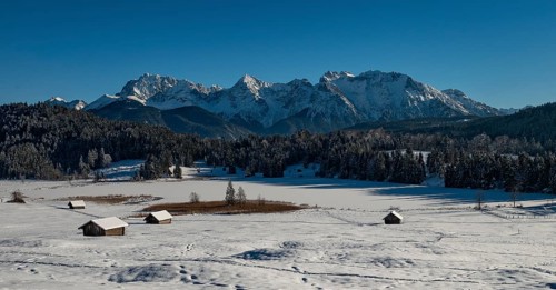 Frozen Lake Geroldsee in winter in front of Karwendel Mountains