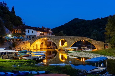 Excursion boats and Old Bridge Stari most at dusk