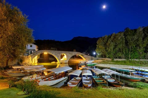 Excursion boats and Old Bridge Stari most at dusk