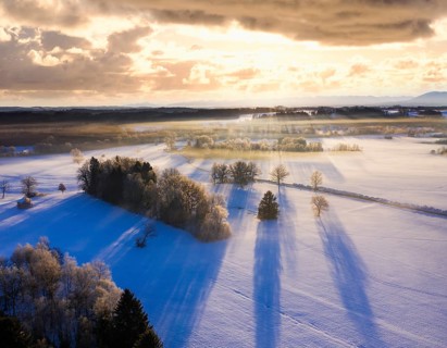 Winter landscape with hoarfrost at sunrise