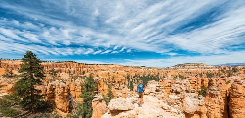 Hiker with backpack in bizarre landscape