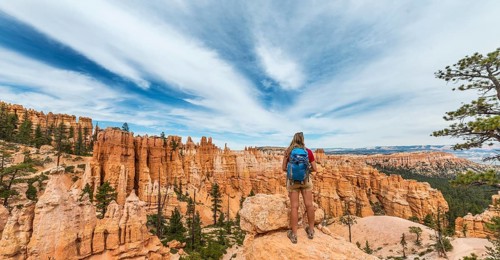 Hiker with backpack in bizarre landscape