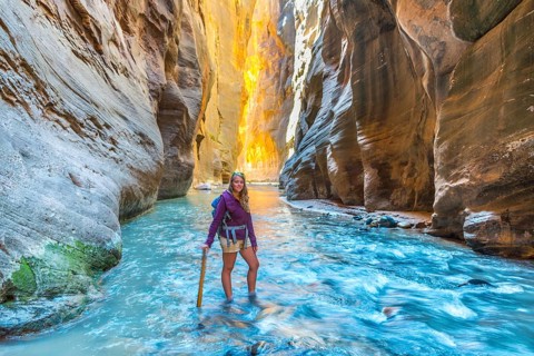 Hiker standing in river
