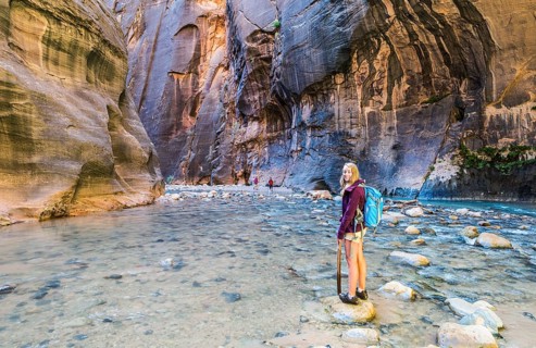 Hiker standing in river