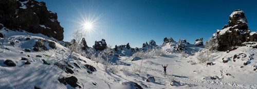 Woman on trail in snowy landscape