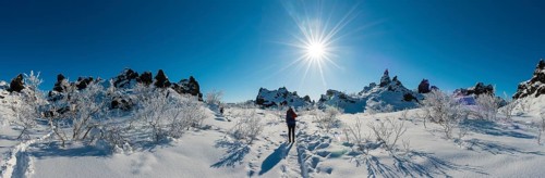Woman on trail in snowy landscape