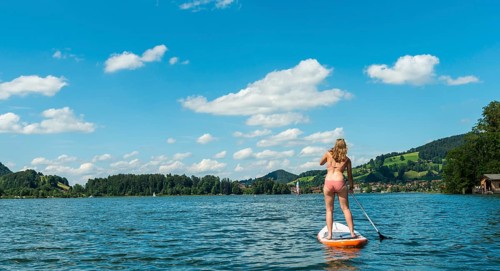 Young woman on a standing paddle board