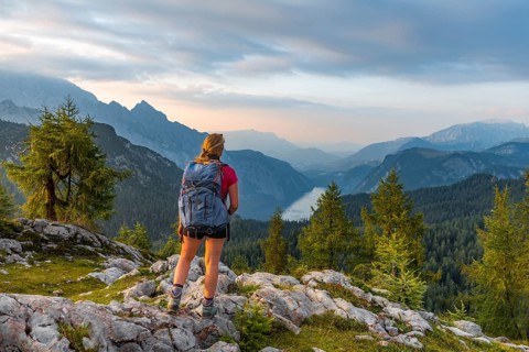 Hiker looks at mountain panorama