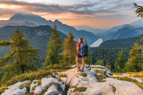 Hiker looks at mountain panorama