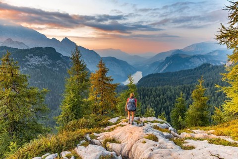 Hiker looks at mountain panorama