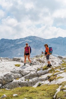 Two hikers look into the camera