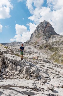 Hiker stands on rocks