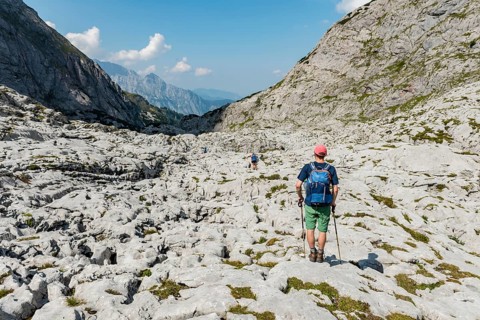 Hiker crosses rocks