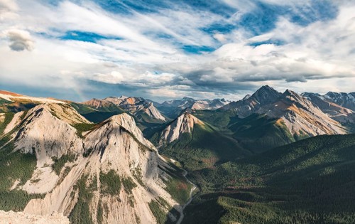 Panoramic view on mountain landscape with rainbow