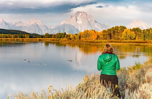 Young woman looking over autumn landscape