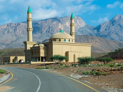 Mosque against mountain chain Jabal Misht