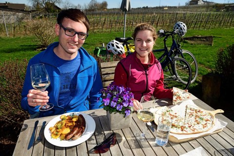 Cyclist at the rest with Flamkuchen