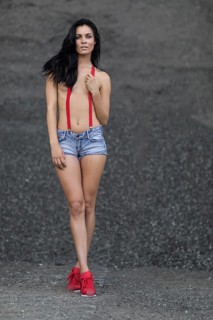 Woman with jeans hotpants and red suspenders
