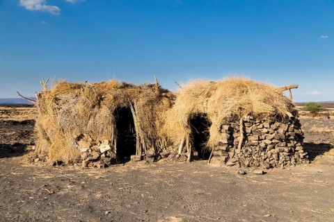 Huts in the Afar settlement at the foot of the active volcano Erta Ale