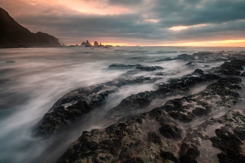 Rocky coast washed by the sea