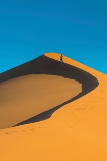 Woman on the the giant sanddune Dune 45