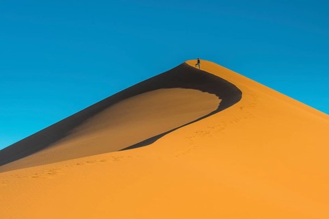 Woman on the giant sanddune Dune 45
