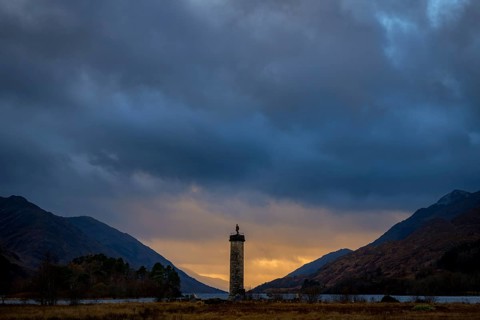 Loch Shiel with Glenfinnan Monument under threatening cloudy sky