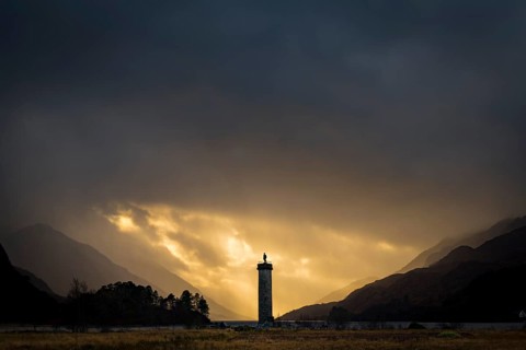 Loch Shiel with Glenfinnan Monument under threatening cloudy sky