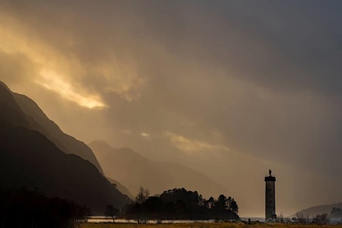 Loch Shiel with Glenfinnan Monument under threatening cloudy sky