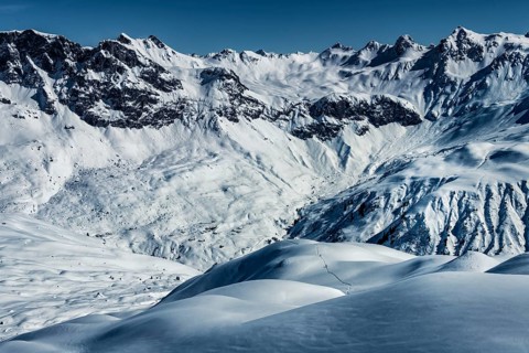 Ski mountaineers in winter landscape with Vorarlberger mountains in the background