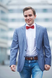 Young business man walking on street