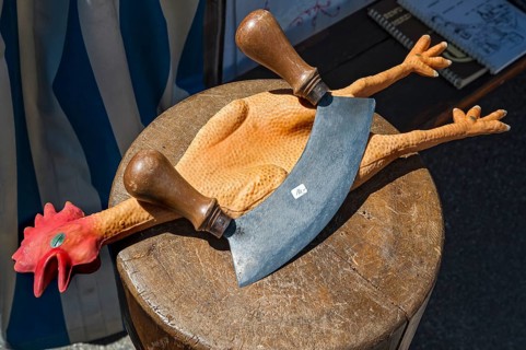 Rubber chicken with mezzaluna knife
