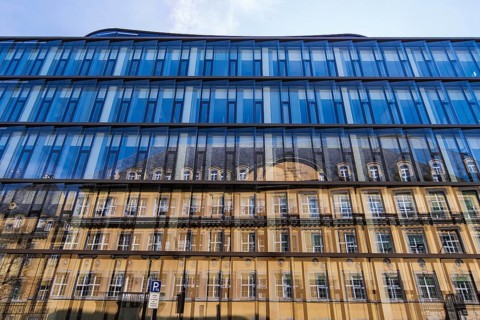 Blue glass facade with reflection