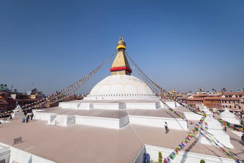 Buddhist stupa with prayer flags