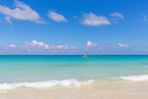 Sailboat in turquoise water