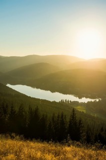 View from Hochfirst to Lake Titisee and Feldberg mountain at sunset