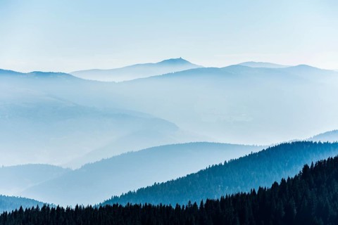 Staggered mountain ranges in the haze
