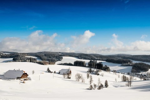 Snow-covered landscape and farmhouses