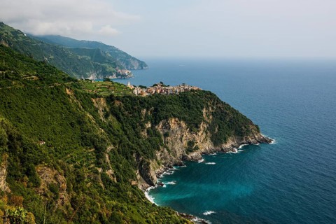 Mountain village with colourful houses on the coast