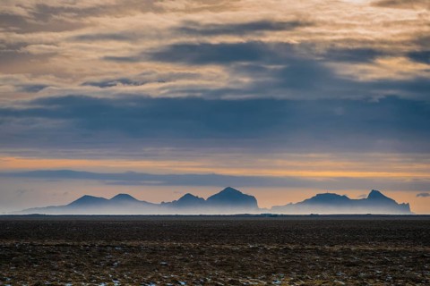 View from the mainland to the Westman Islands with cloudy sky