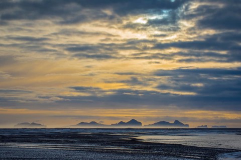 View from the mainland to the Westman Islands with cloudy sky