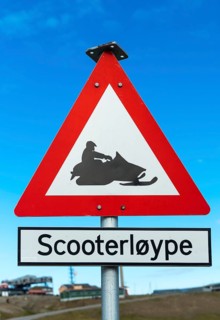 Snow mobile warning road signpost