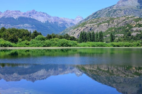 Mountain scenery reflected in the water of the Rio Futaleufu