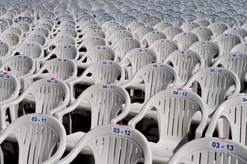 Numbered white plastic chairs