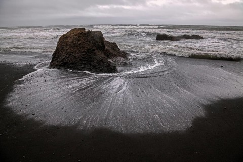 Lava beach and disturbed sea