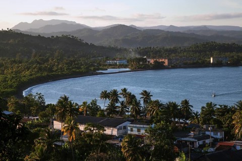 View of houses and the Bahia de Miel bay
