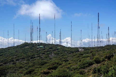 Many transmitter masts on mountain ridges