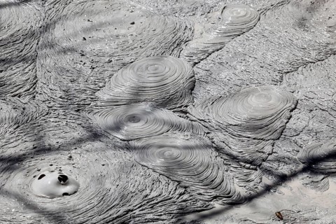Fumarole with bubbling grey mud